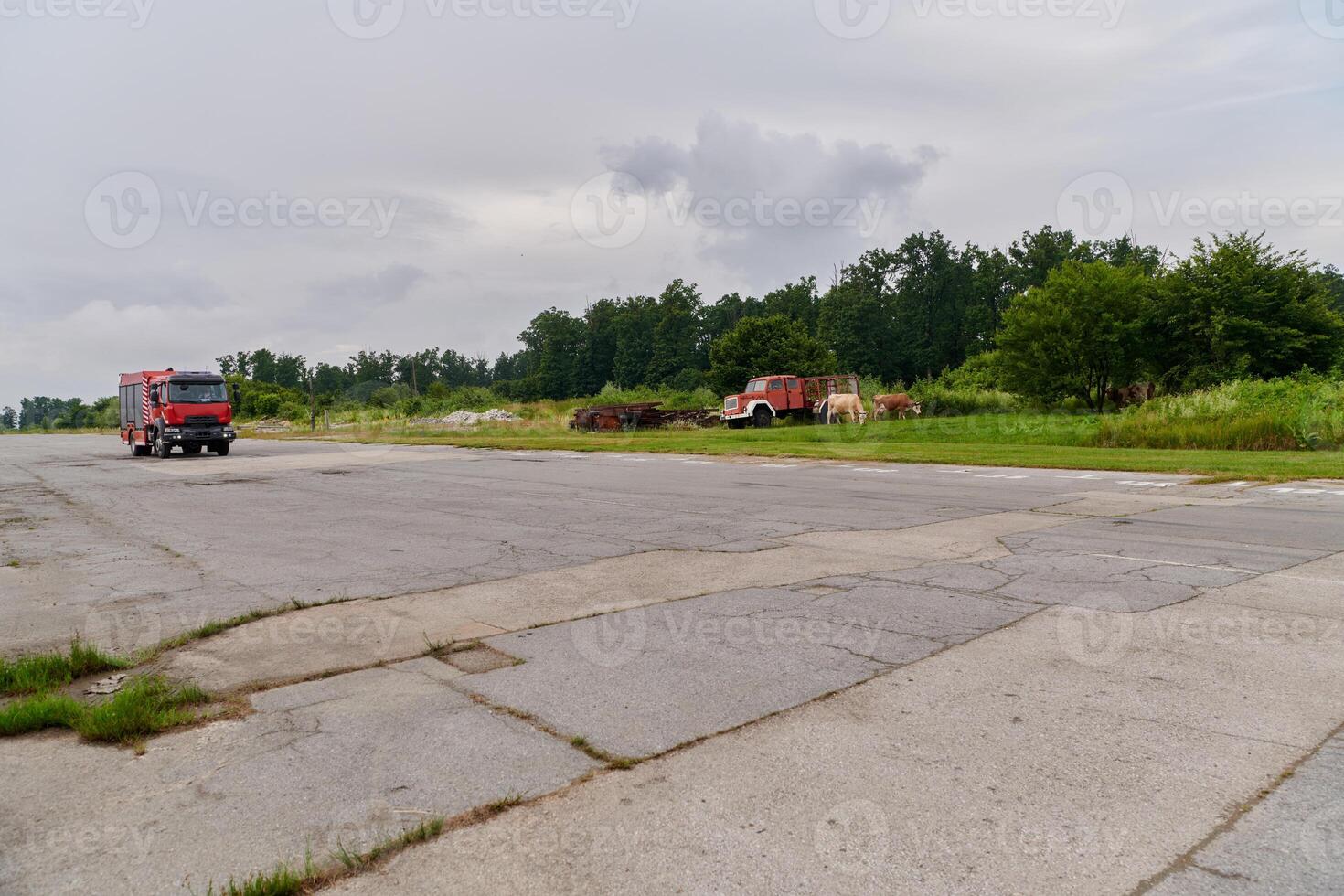 In this captivating scene, a state-of-the-art firetruck, equipped with advanced rescue technology, stands ready with its skilled firefighting team, prepared to intervene and respond rapidly to photo