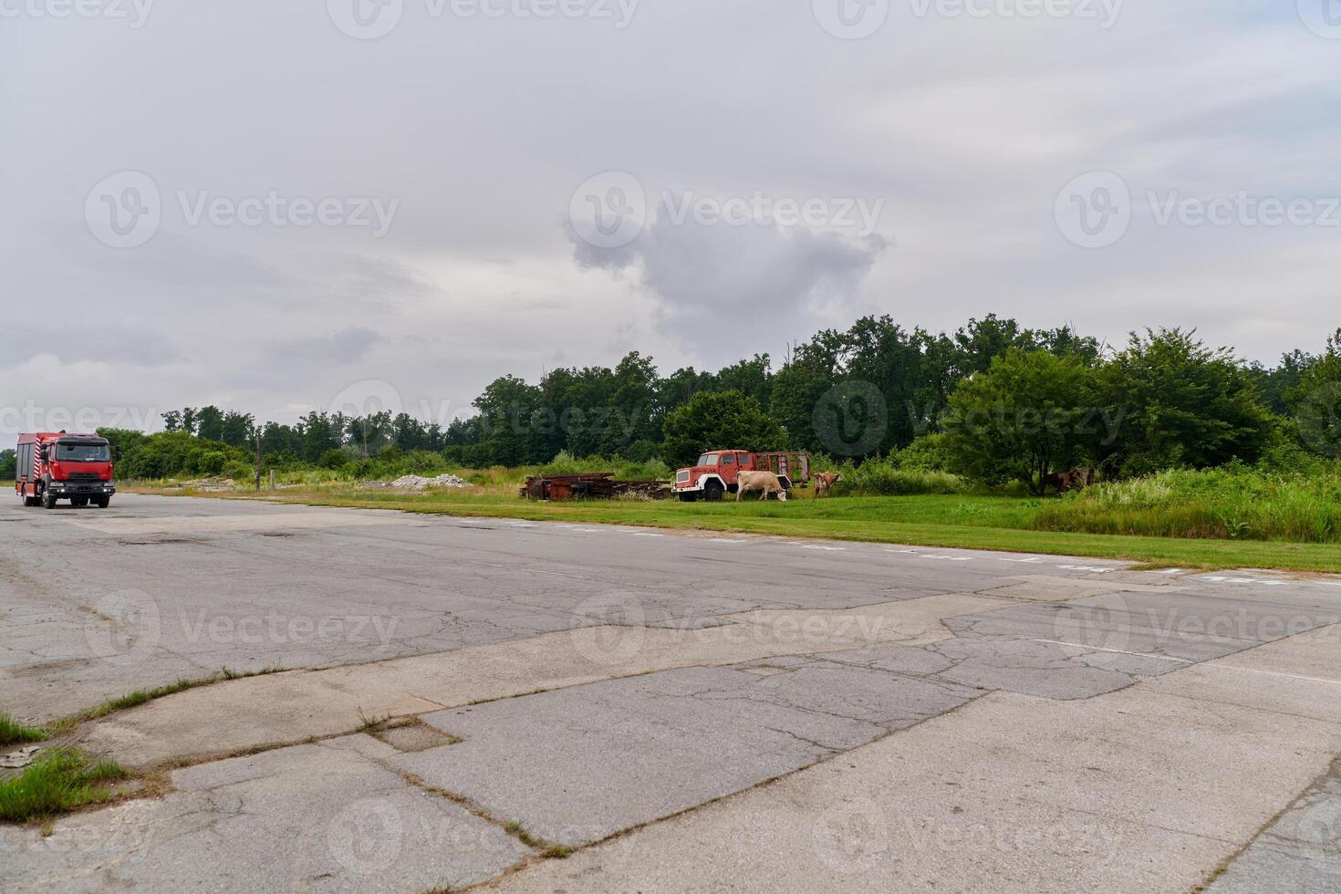 In this captivating scene, a state-of-the-art firetruck, equipped with advanced rescue technology, stands ready with its skilled firefighting team, prepared to intervene and respond rapidly to photo