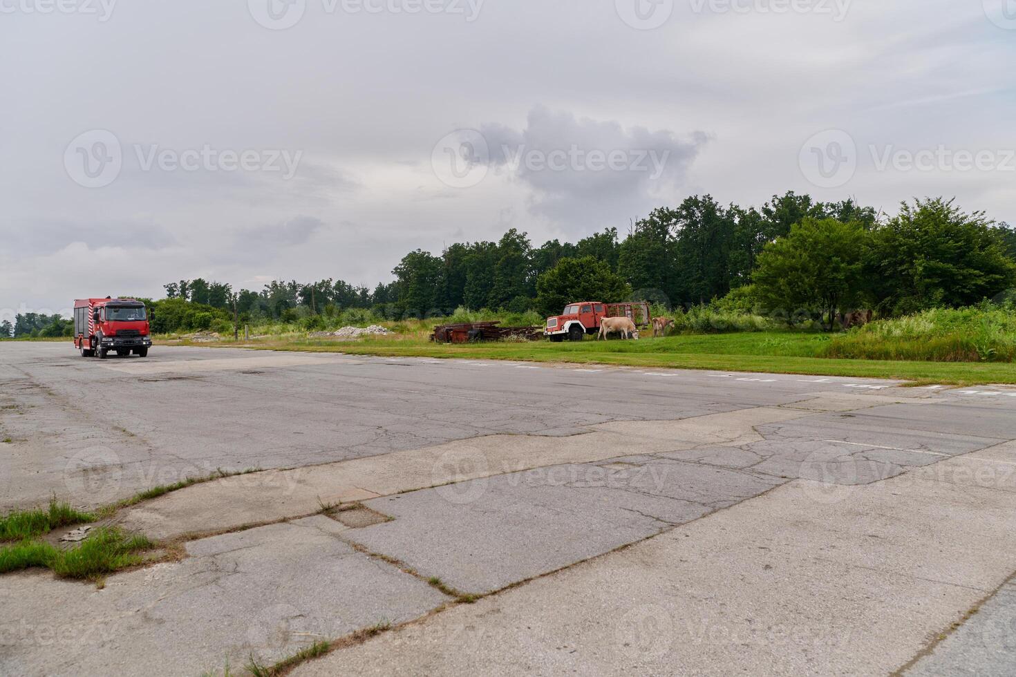In this captivating scene, a state-of-the-art firetruck, equipped with advanced rescue technology, stands ready with its skilled firefighting team, prepared to intervene and respond rapidly to photo