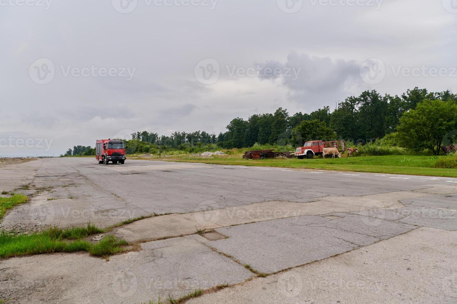 In this captivating scene, a state-of-the-art firetruck, equipped with advanced rescue technology, stands ready with its skilled firefighting team, prepared to intervene and respond rapidly to photo
