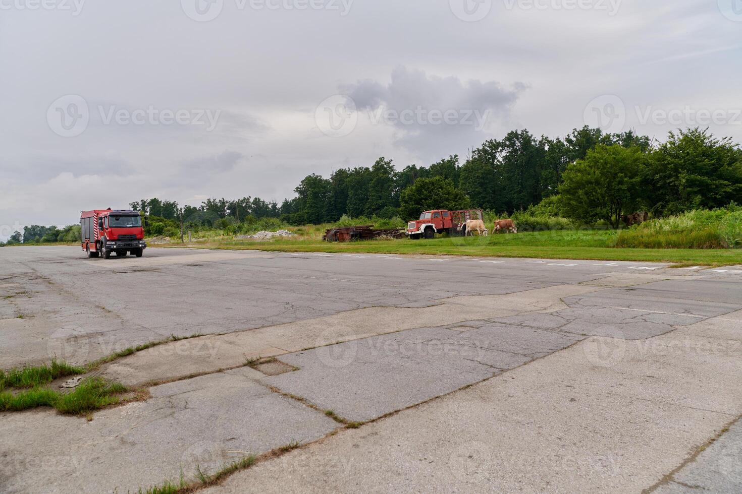 In this captivating scene, a state-of-the-art firetruck, equipped with advanced rescue technology, stands ready with its skilled firefighting team, prepared to intervene and respond rapidly to photo