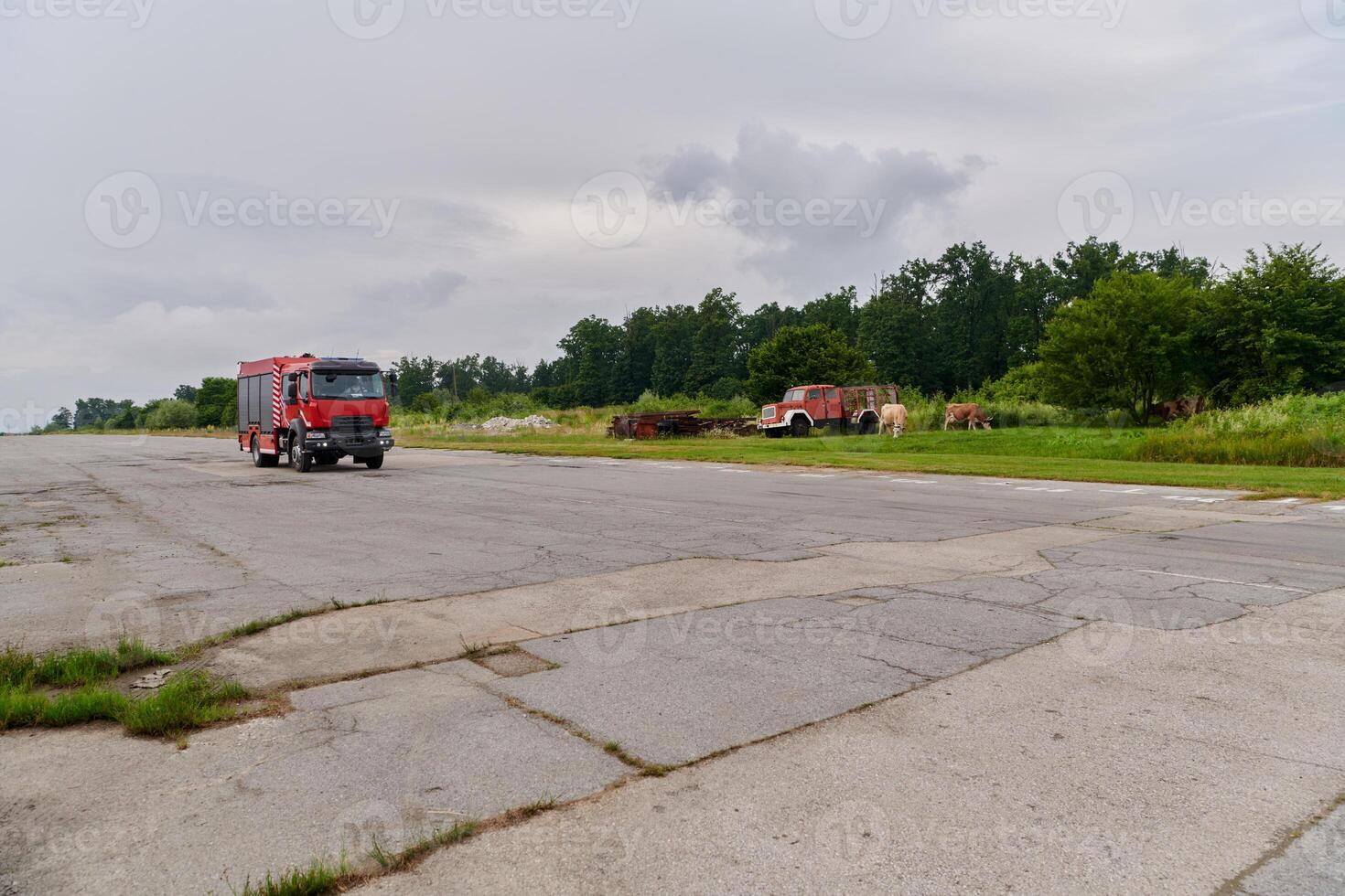 In this captivating scene, a state-of-the-art firetruck, equipped with advanced rescue technology, stands ready with its skilled firefighting team, prepared to intervene and respond rapidly to photo