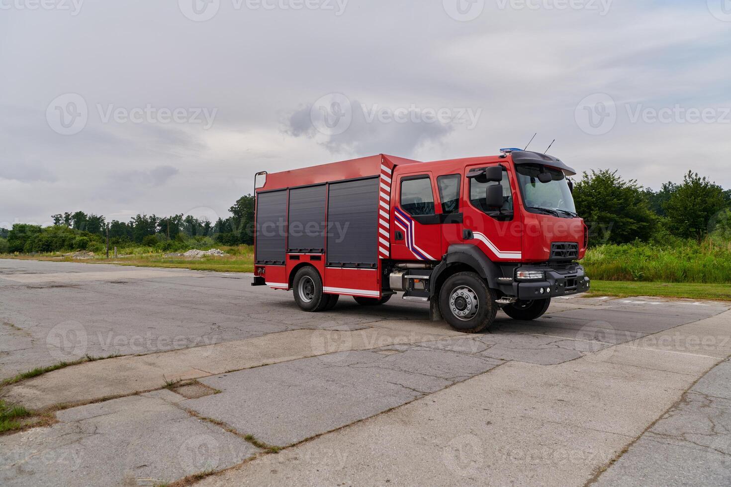 In this captivating scene, a state-of-the-art firetruck, equipped with advanced rescue technology, stands ready with its skilled firefighting team, prepared to intervene and respond rapidly to photo