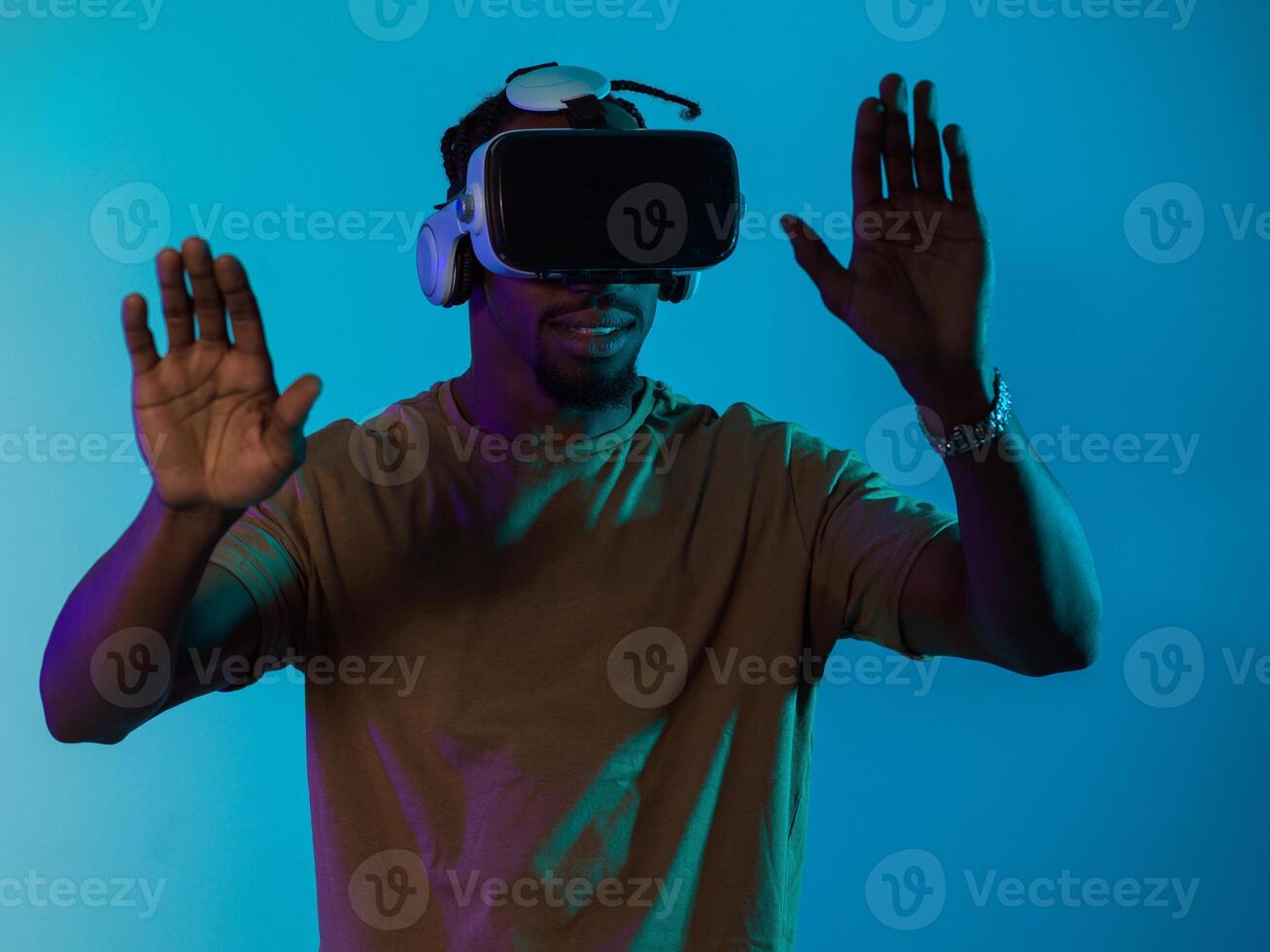 Immersed in a digital realm, an African American man navigates the virtual landscape with a VR goggles, using tactile gestures to interact with virtual objects, showcasing a harmonious blend of photo