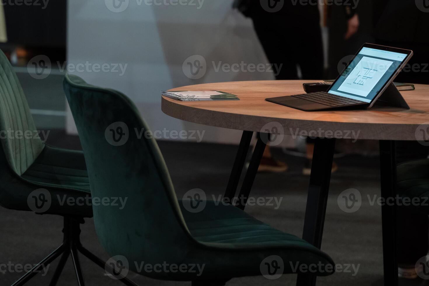 digital tablet computer placed on a wooden table in a modern office photo