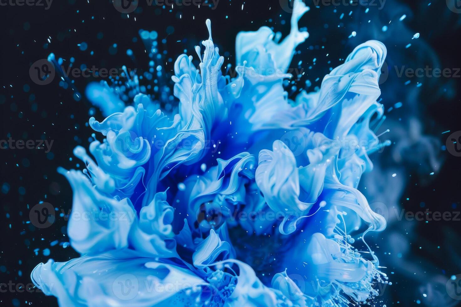 Photo of a Dynamic Explosion of Blue Paint Against a Dark Background