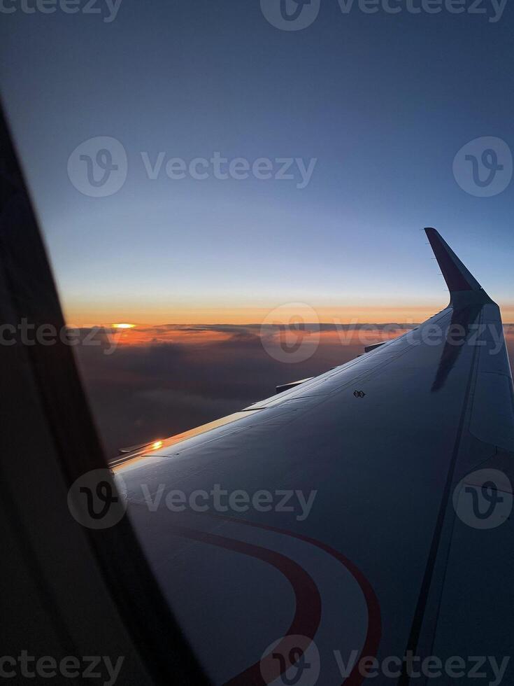 Airplane wing view from the window photo