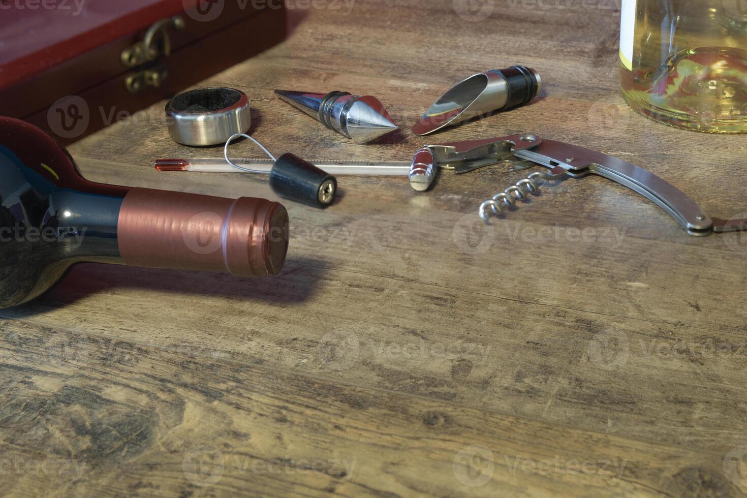 Custom set for wine. Additional stoppers, means for opening, a corkscrew, a thermometer. On the texture table. Close-up. Place for text photo