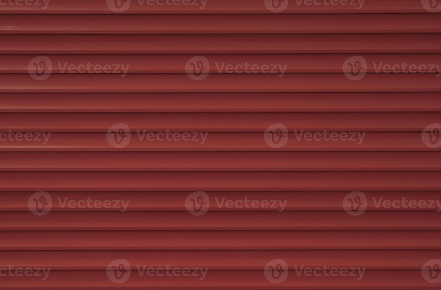 Texture of red old external blinds on windows. Painted wooden surface. Creative background photo