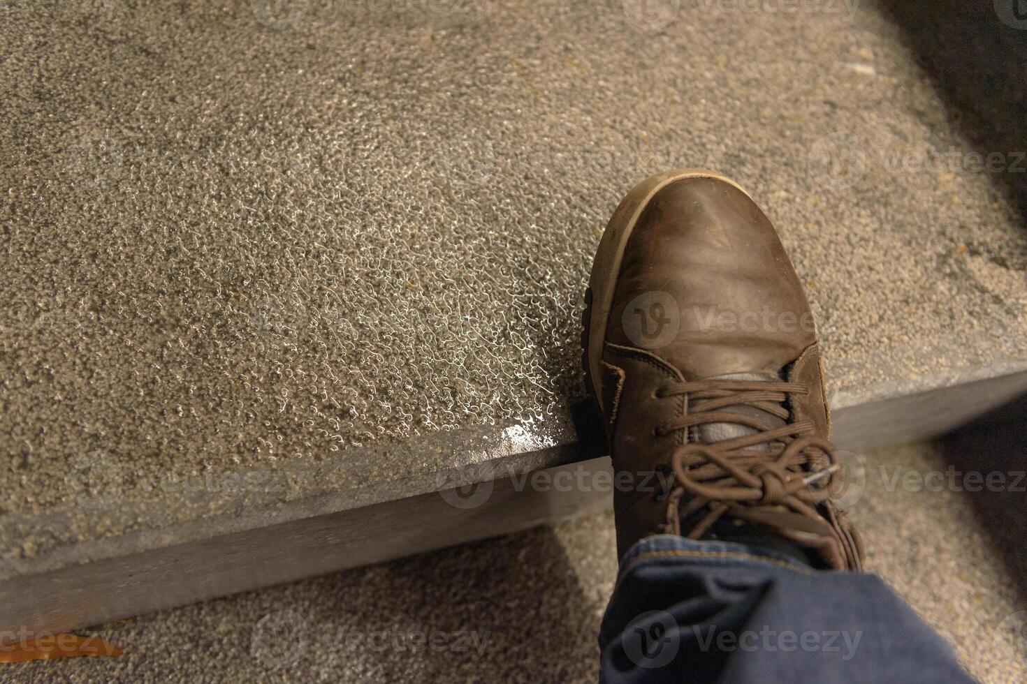 Danger of falling. Slippery steps after rain. close up photo