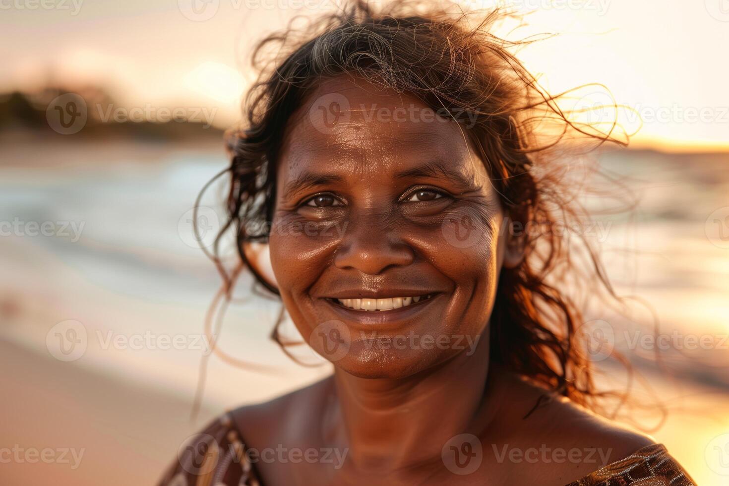 Aboriginal Australian Woman Smiling At Sunset photo