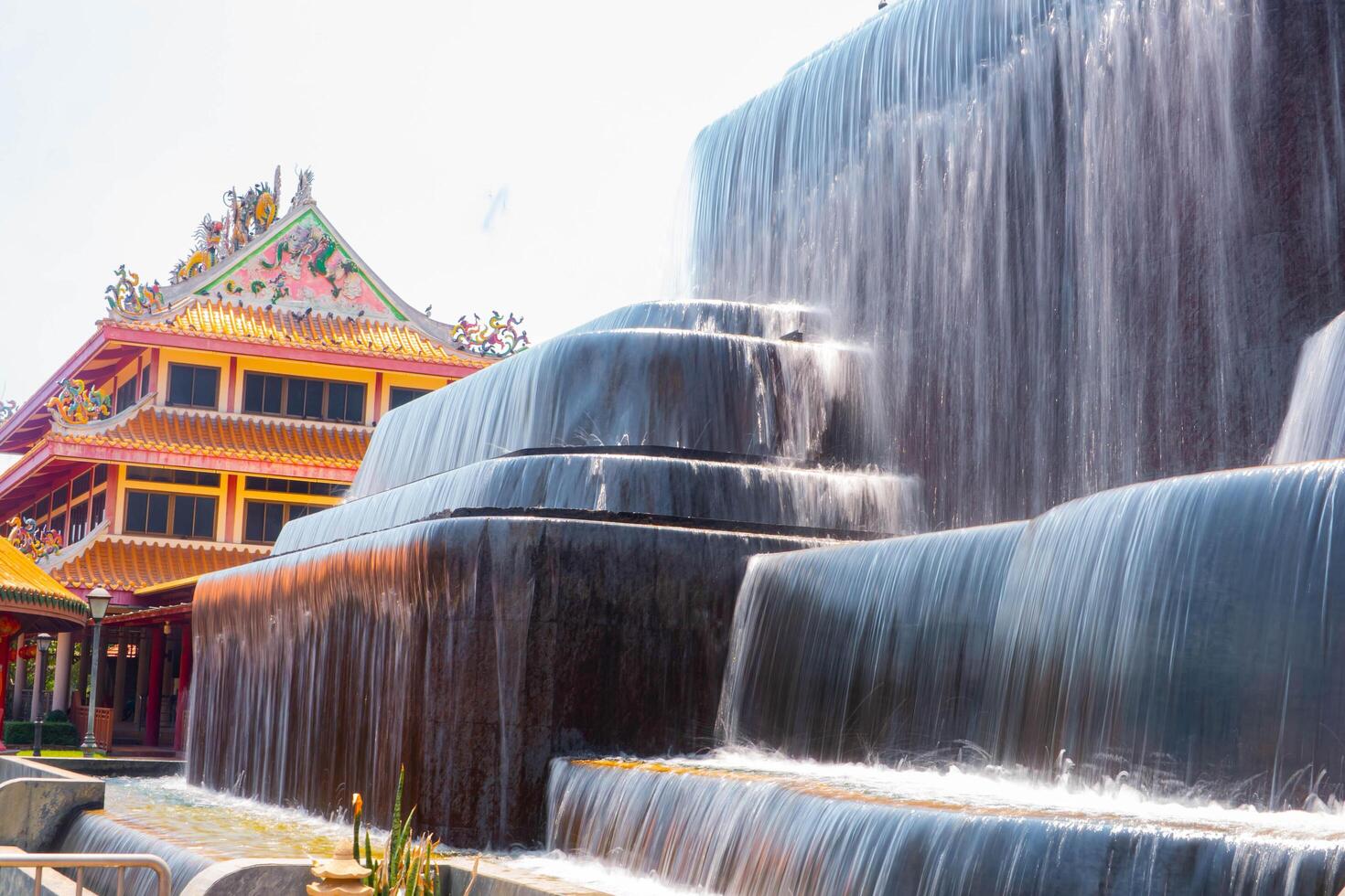 Extended fountain wall exposure with a Chinese-style structure photo
