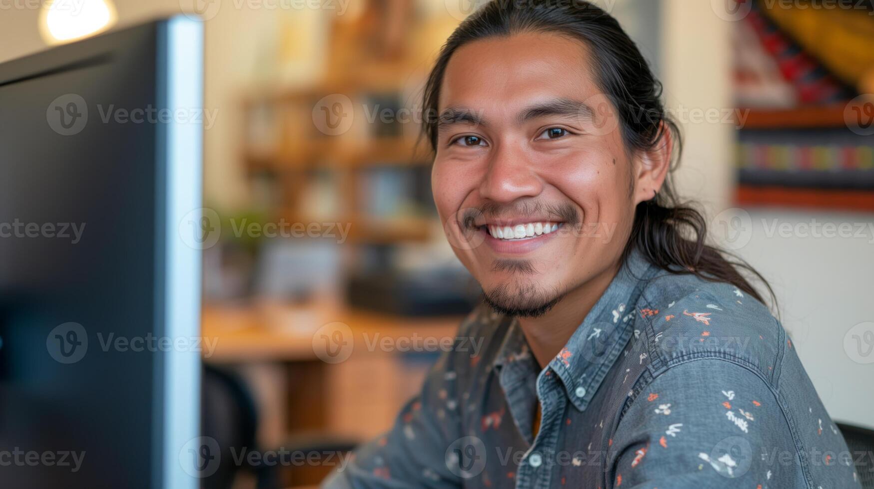 Professional Indigenous Man Working in Modern Office Setting, Smiling, and Confident photo