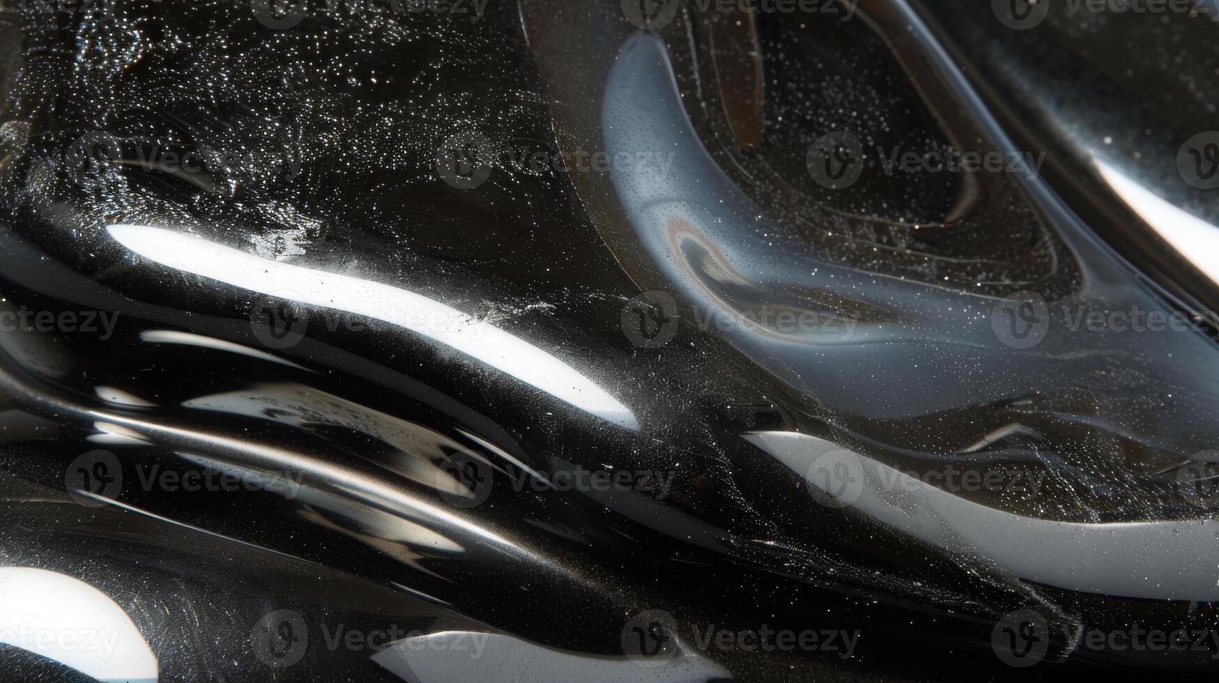 Reflective Black and Silver Polished Stone with Smooth Texture - Perfect for Design, Poster, Card, and Print Projects photo