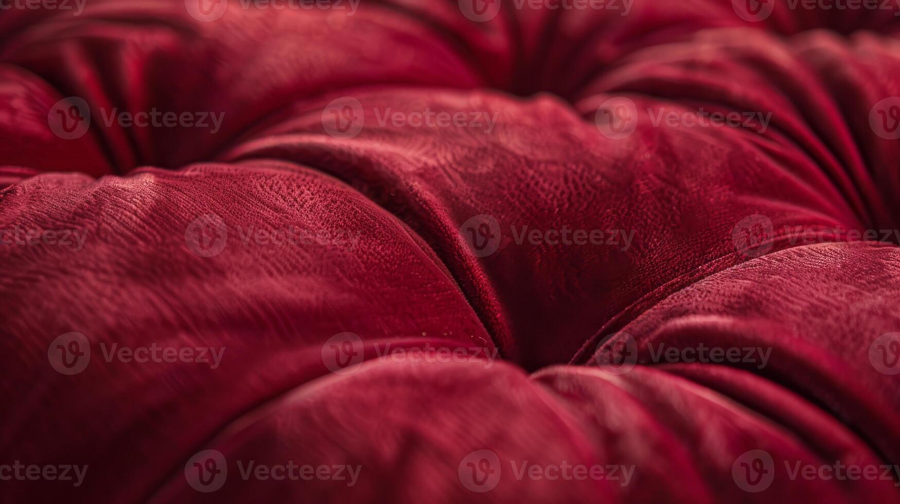 Luxurious Red Velvet Cushion Close-Up Texture for Interior Design, Background Elements, and Fabric Studies photo