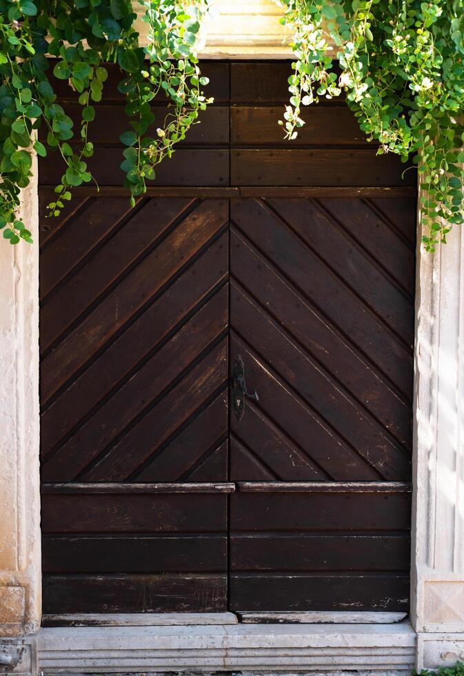 Old vintage wooden brown door. Budva. Montenegro. photo