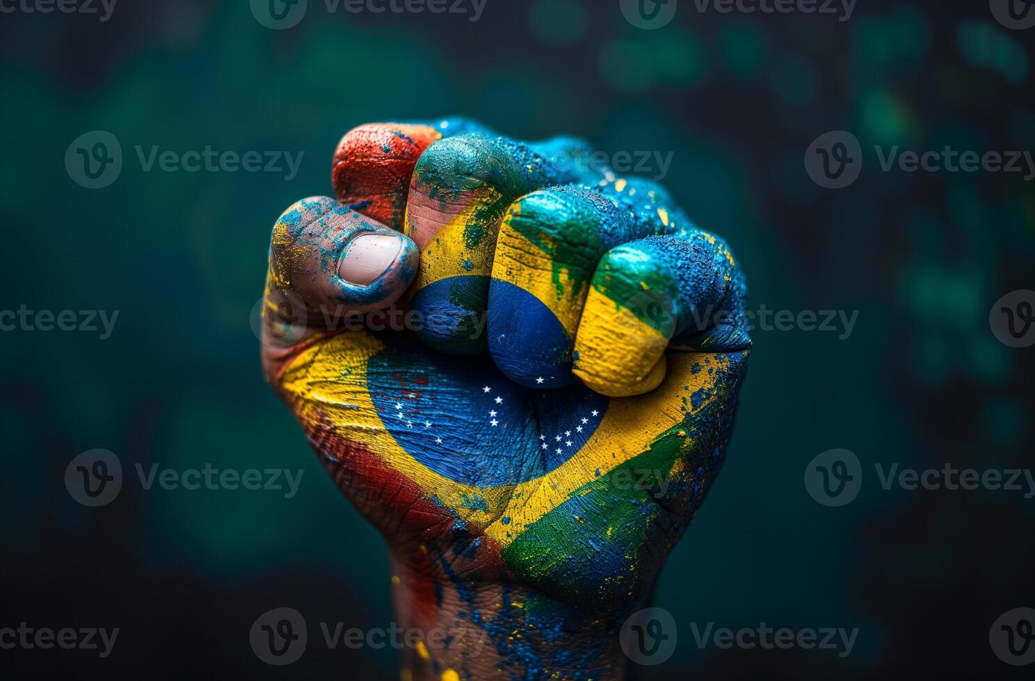 Closed hand painted with the colors of the Brazilian flag photo