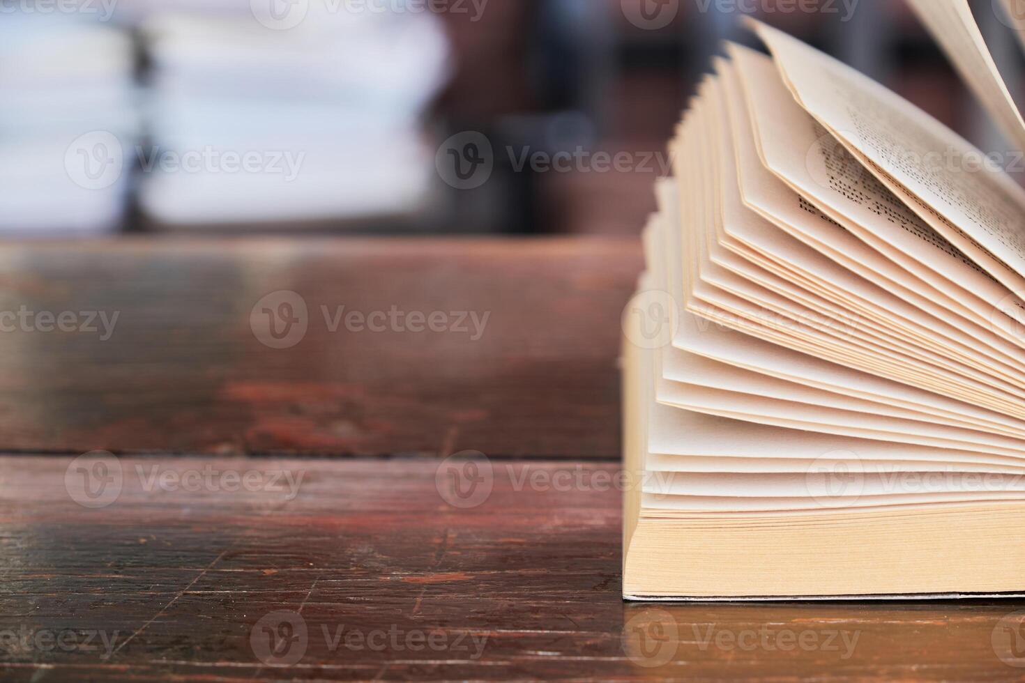 Open books on the table photo