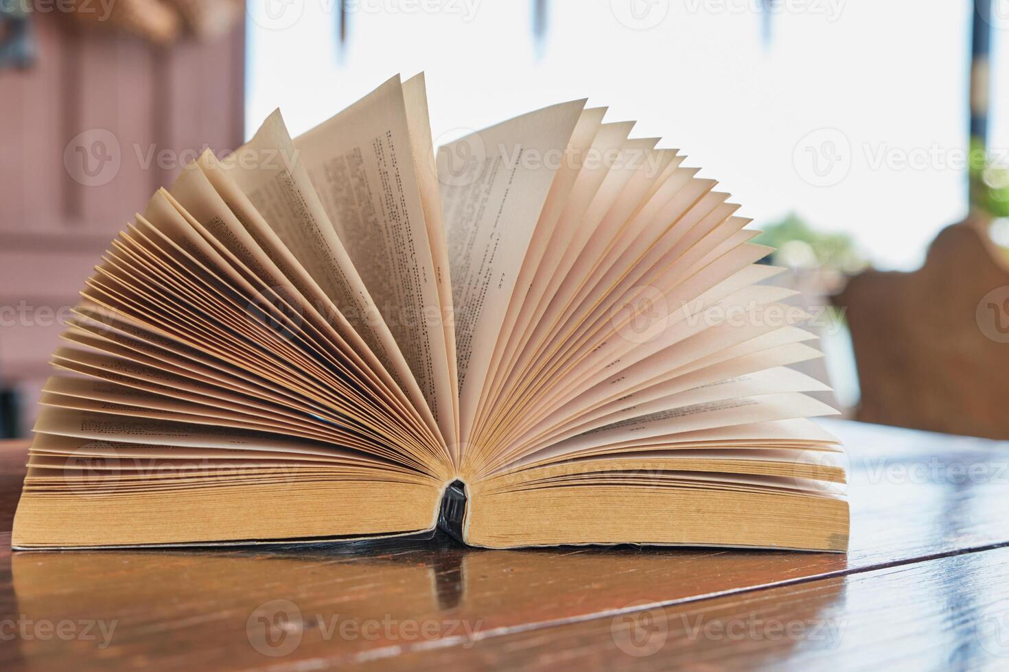 Open books on the table photo