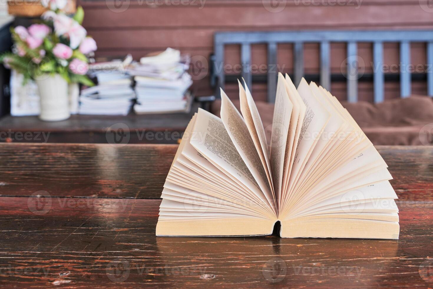 Open books on the table photo