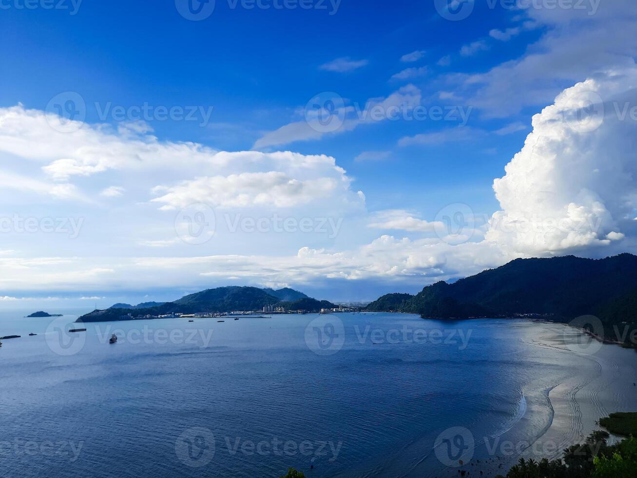 beautiful view of the sea and cloudy sky from the hill in the Bukit Lampu area, Teluk Bayur, Padang city photo