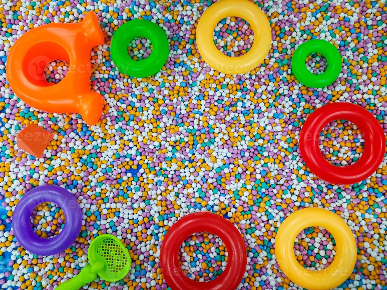 Toddler toys frame with copy space on colorful background photo
