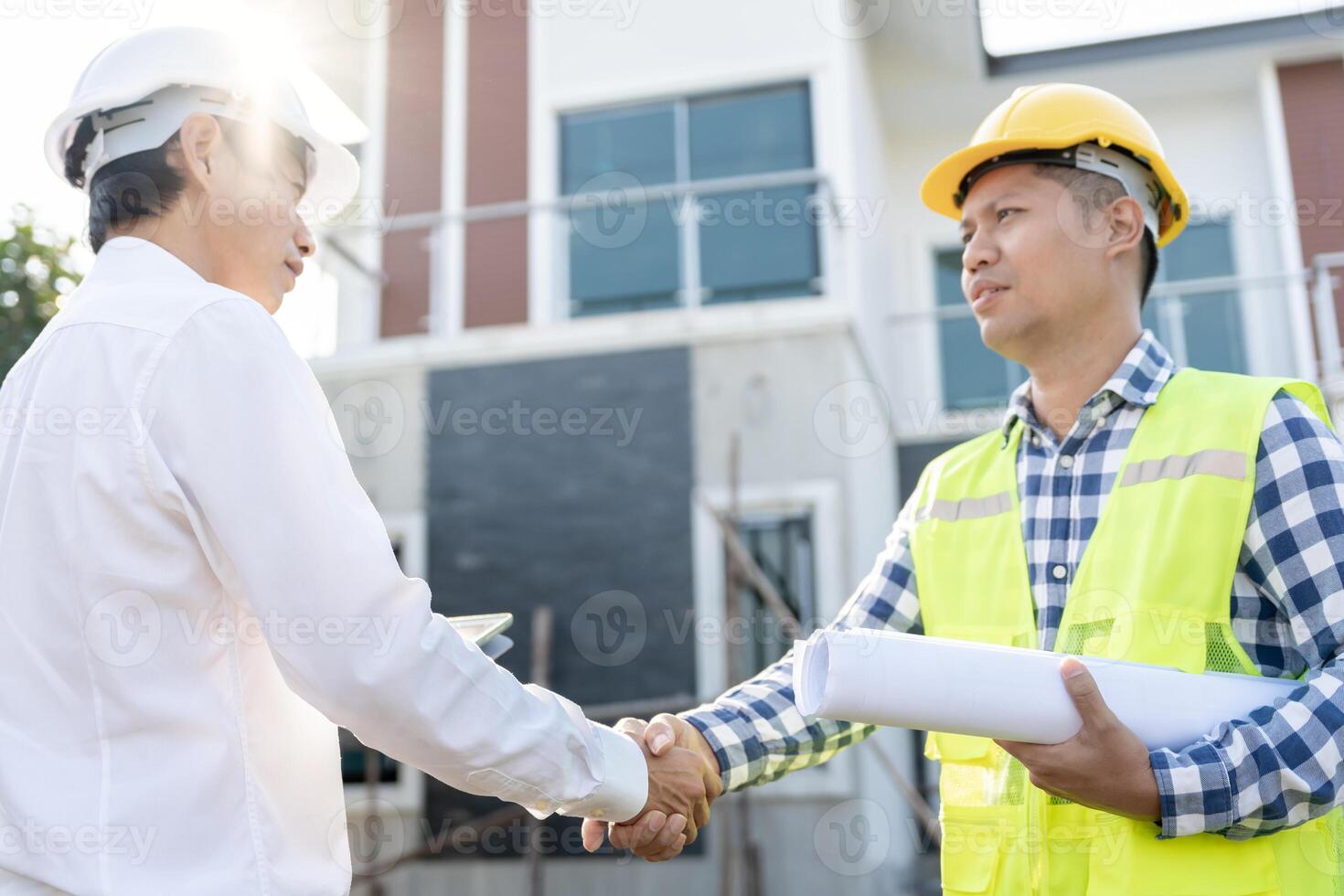 Construction team hands shaking greeting start up plan new project contract in office center at construction site, industry ,architecture, partner, teamwork, agreement, property, contacts. photo