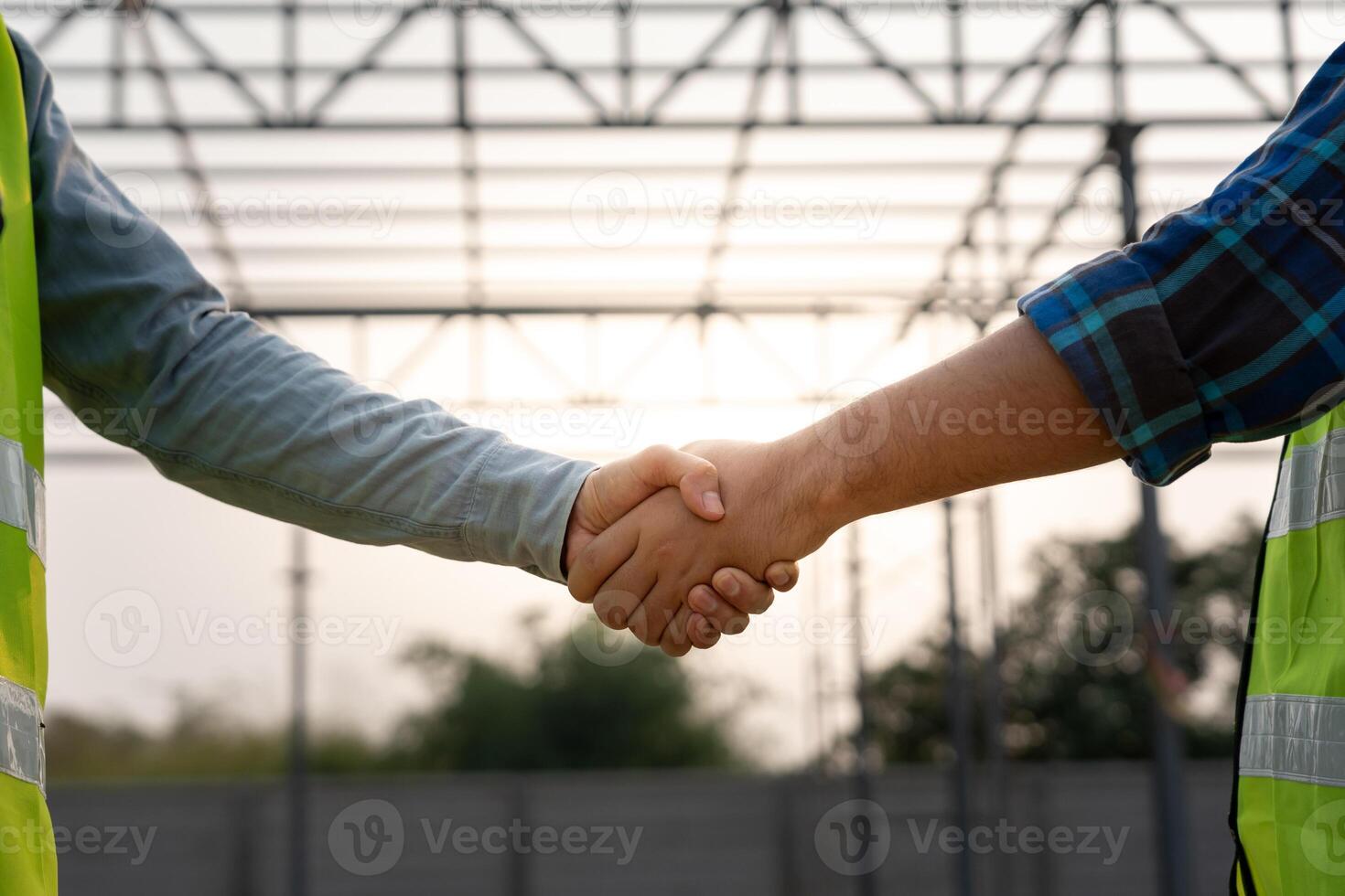 Construction team hands shaking greeting start up plan new project contract in office center at construction site, industry ,architecture, partner, teamwork, agreement, property, contacts. photo