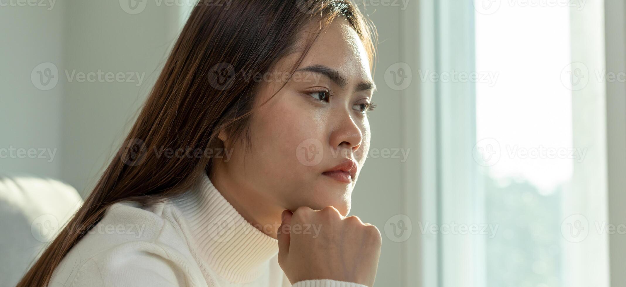 Depression and mental illness. Asian woman disappointed, sad after receiving bad news. Stressed girl confused with unhappy problems, arguing with boyfriend, cry and worry about unexpected pregnancy photo