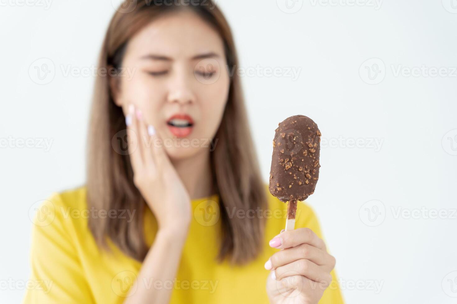 Asian woman feel sensitive teeth after eating ice cream, female suffer tooth, decay problems, dental care, tooth extraction, decay problem, bad breath, Gingival Recession, Oral Hygiene instruction photo