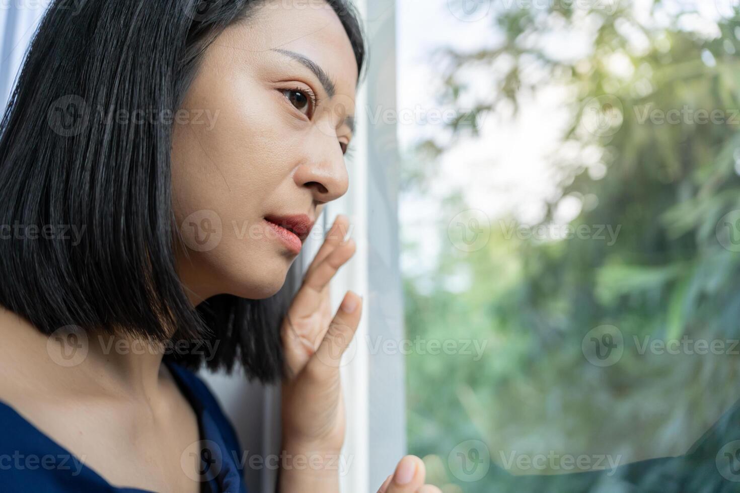 Depression and mental illness. Asian woman disappointed, sad after receiving bad news. Stressed girl confused with unhappy problems, arguing with boyfriend, cry and worry about unexpected pregnancy. photo