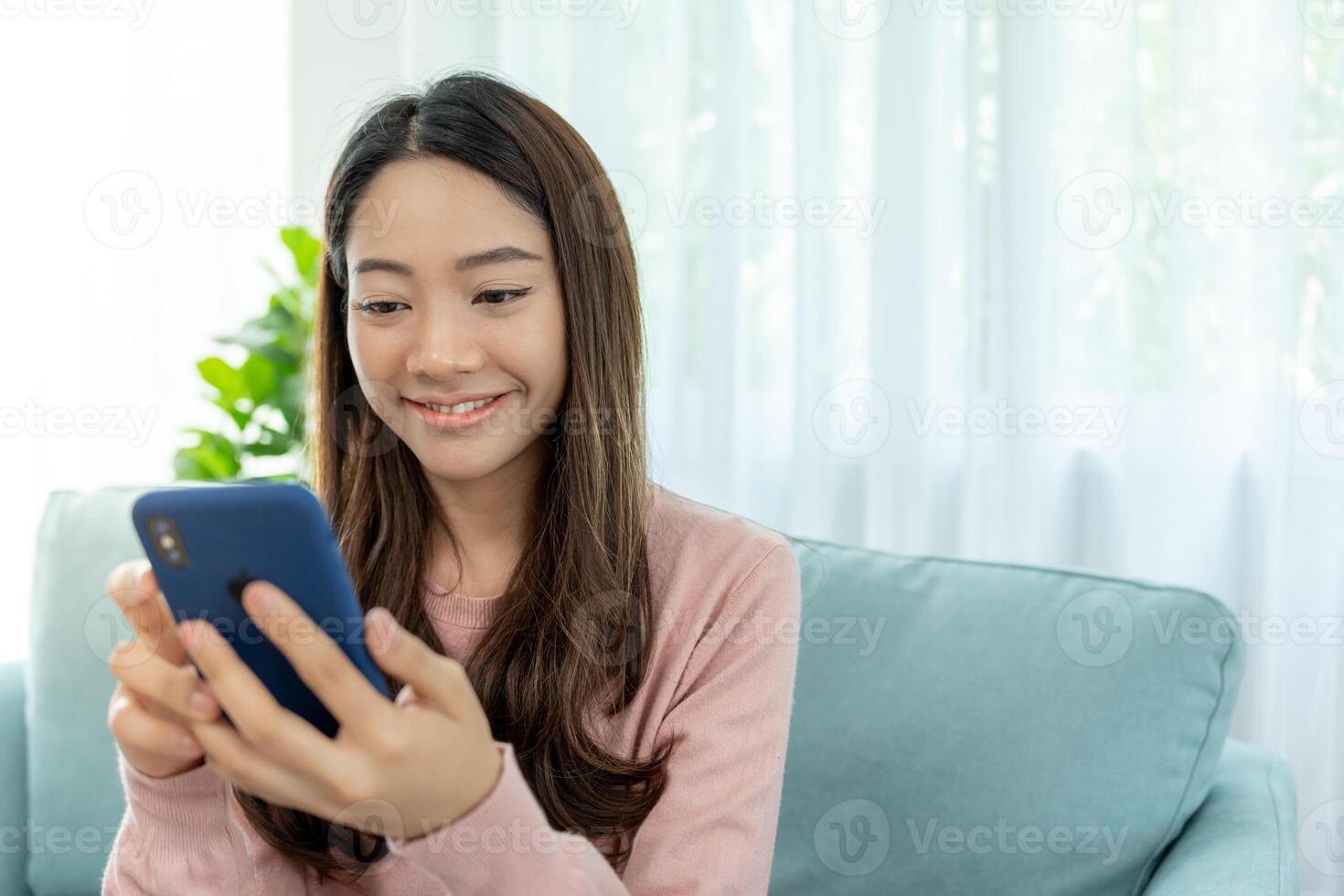 woman using smartphone for online shopping at home. Hand holding mobile phone with payment detail page display and credit card, stay home, technology, electronic commerce, internet, market place photo