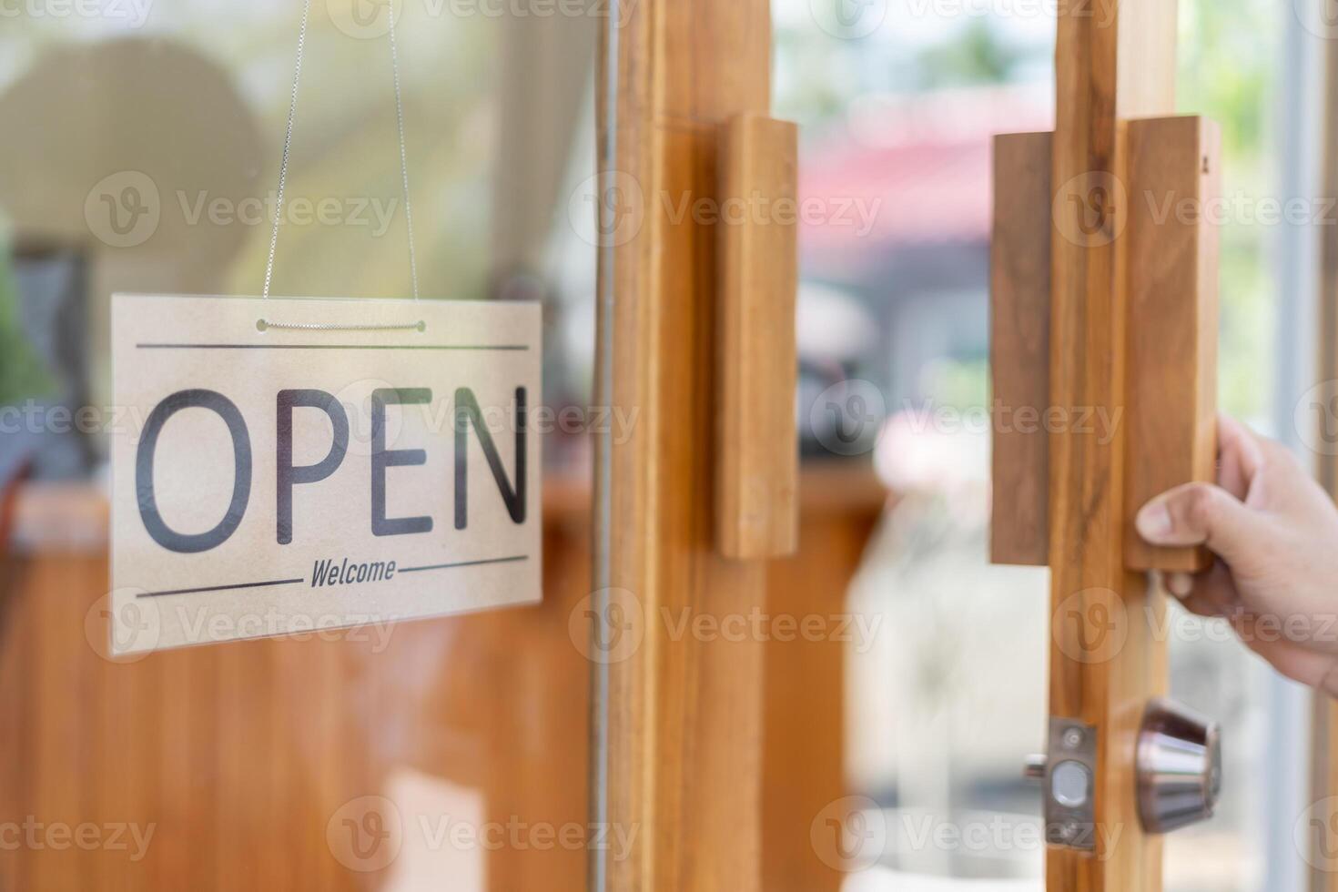 show sign open on the first day of business. guarantees safety, cleanliness, open the coffee shop. open for New normal. Small business, welcome, restaurant, home made, family photo