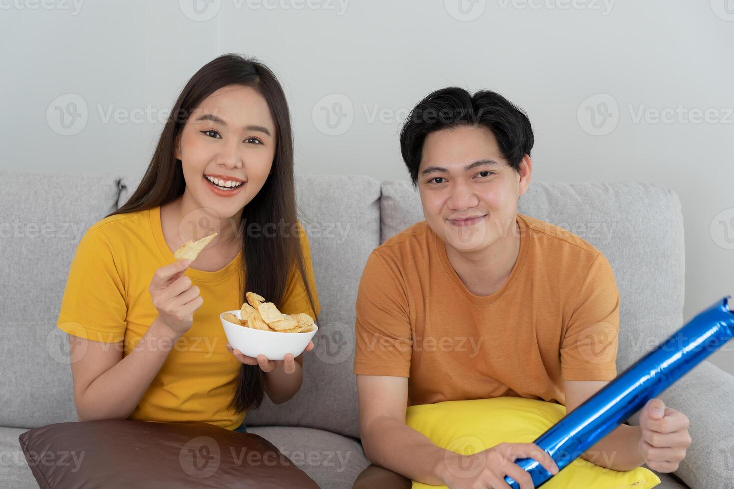 cheerful couple cheer sport, watching sporting, cheering for victory of their team. Happy energetic smiling. tv show, holiday, relax, recreation, soccer, football, series, cinema, cheer, win, fan club photo