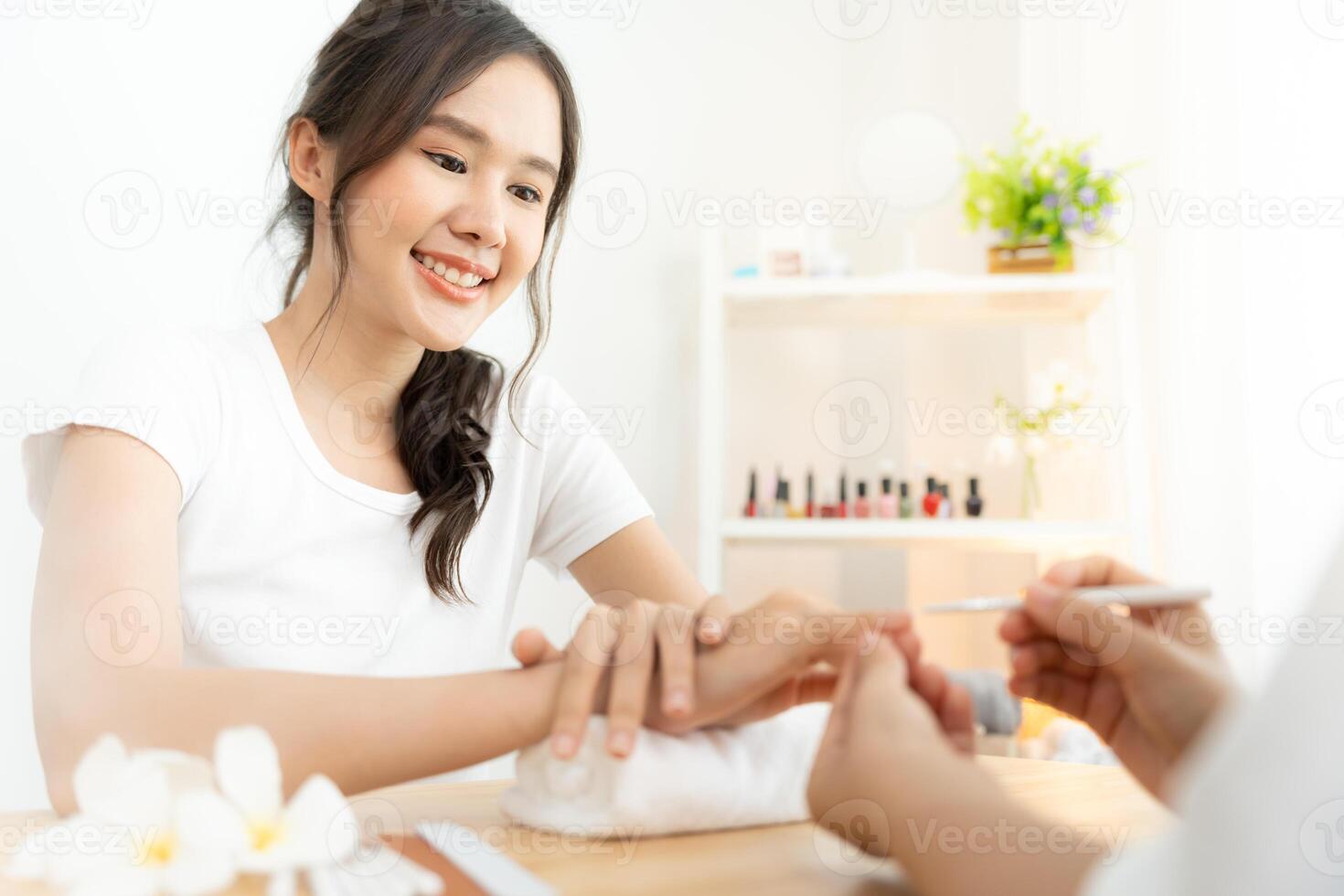 Woman receive care service by professional Beautician Manicure at spa centre. Nail beauty salon use nail file for Glazing treatment. manicurist make nail customer to beautiful. body care spa treatment photo