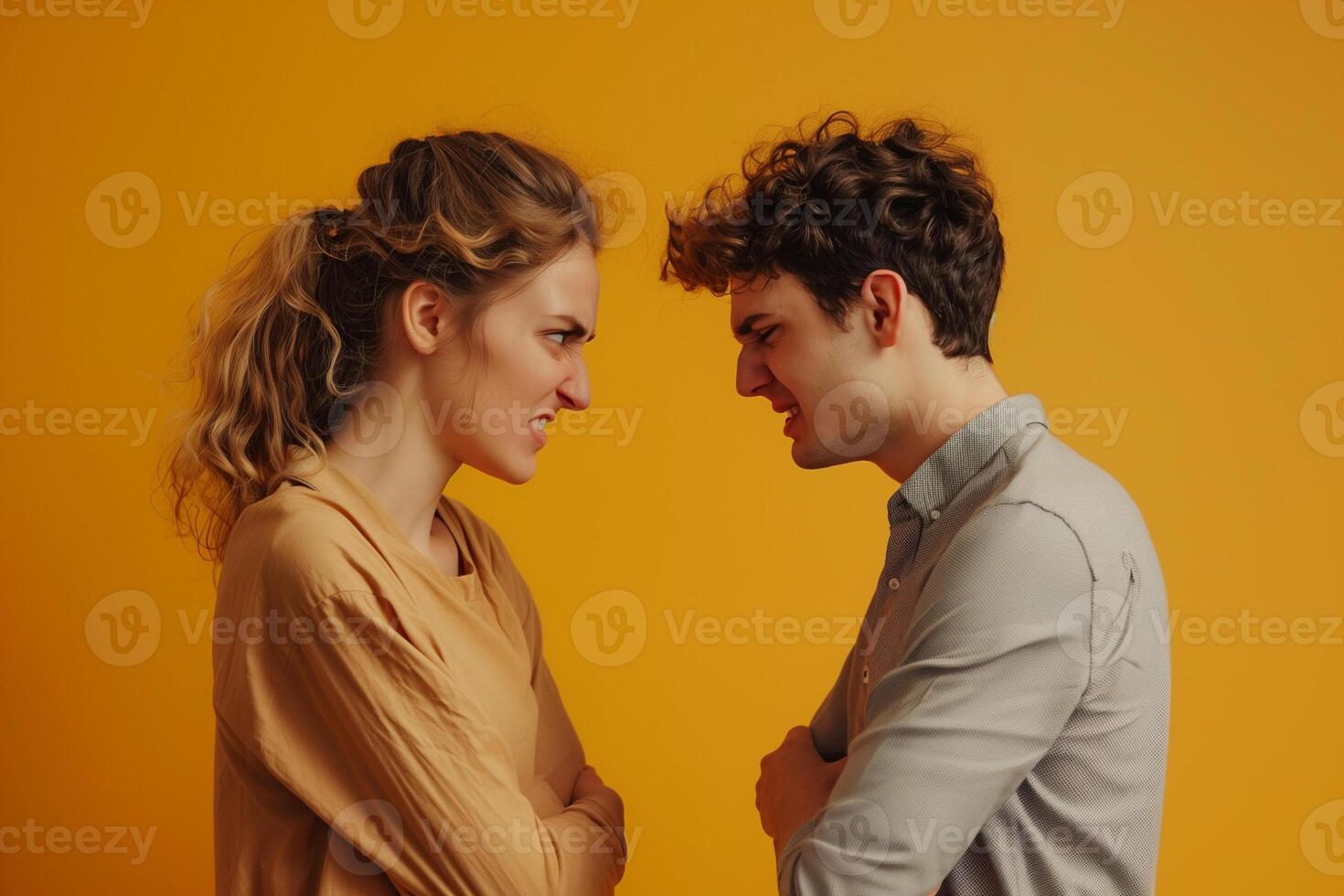Studio shot of stressed couple arguing. Angry, misunderstanding and relationship problems concept photo