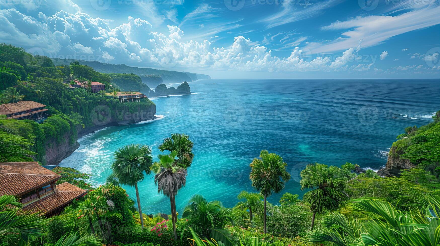 Lush palm trees sway by ocean in this scenic view with oceanfront hotels under blue sky. Tropical landscape photo