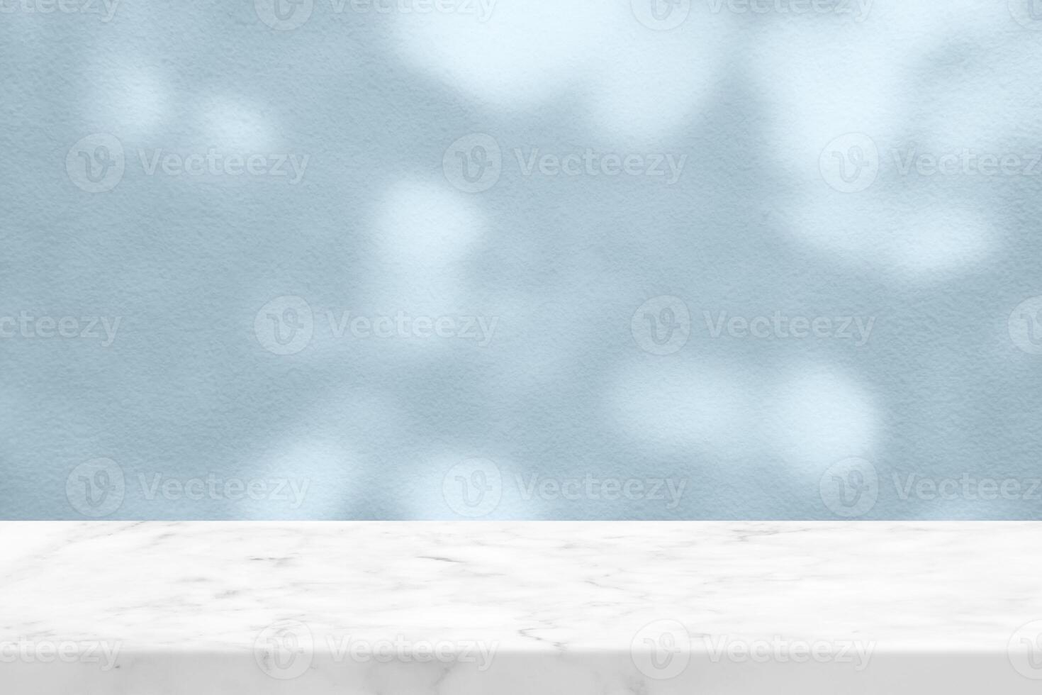White Marble Table with Tree Shadow on Cyan Concrete Wall Texture Background photo