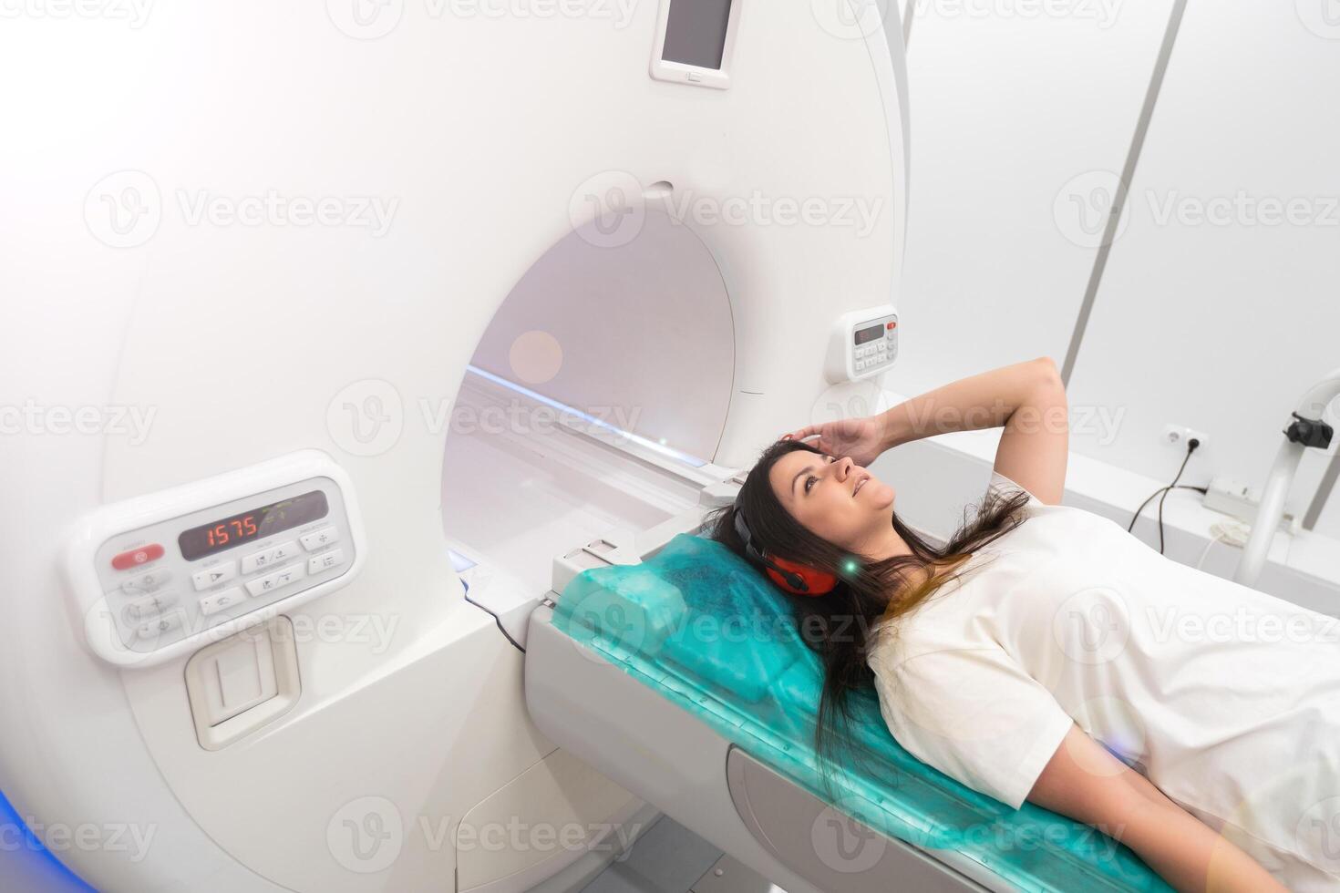 Medical CT or MRI Scan with a patient in the modern hospital laboratory. Interior of radiography department. Technologically advanced equipment in white room. Magnetic resonance diagnostics machine photo