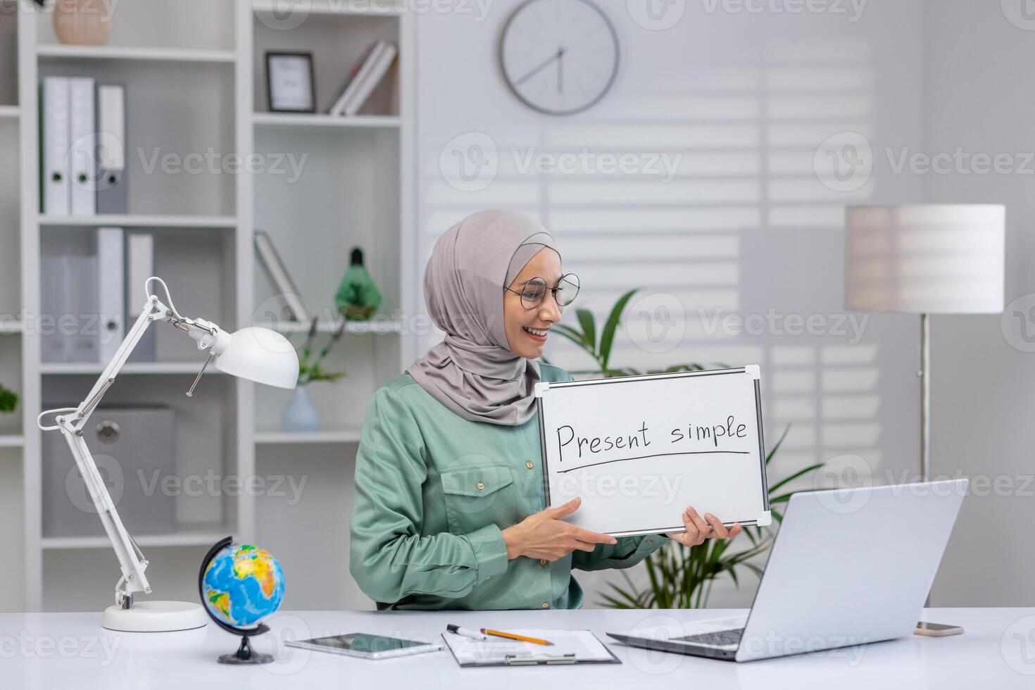 Teacher explaining present simple tense in a virtual class using a whiteboard. Concept of online education, e-learning, and teaching English grammar. photo