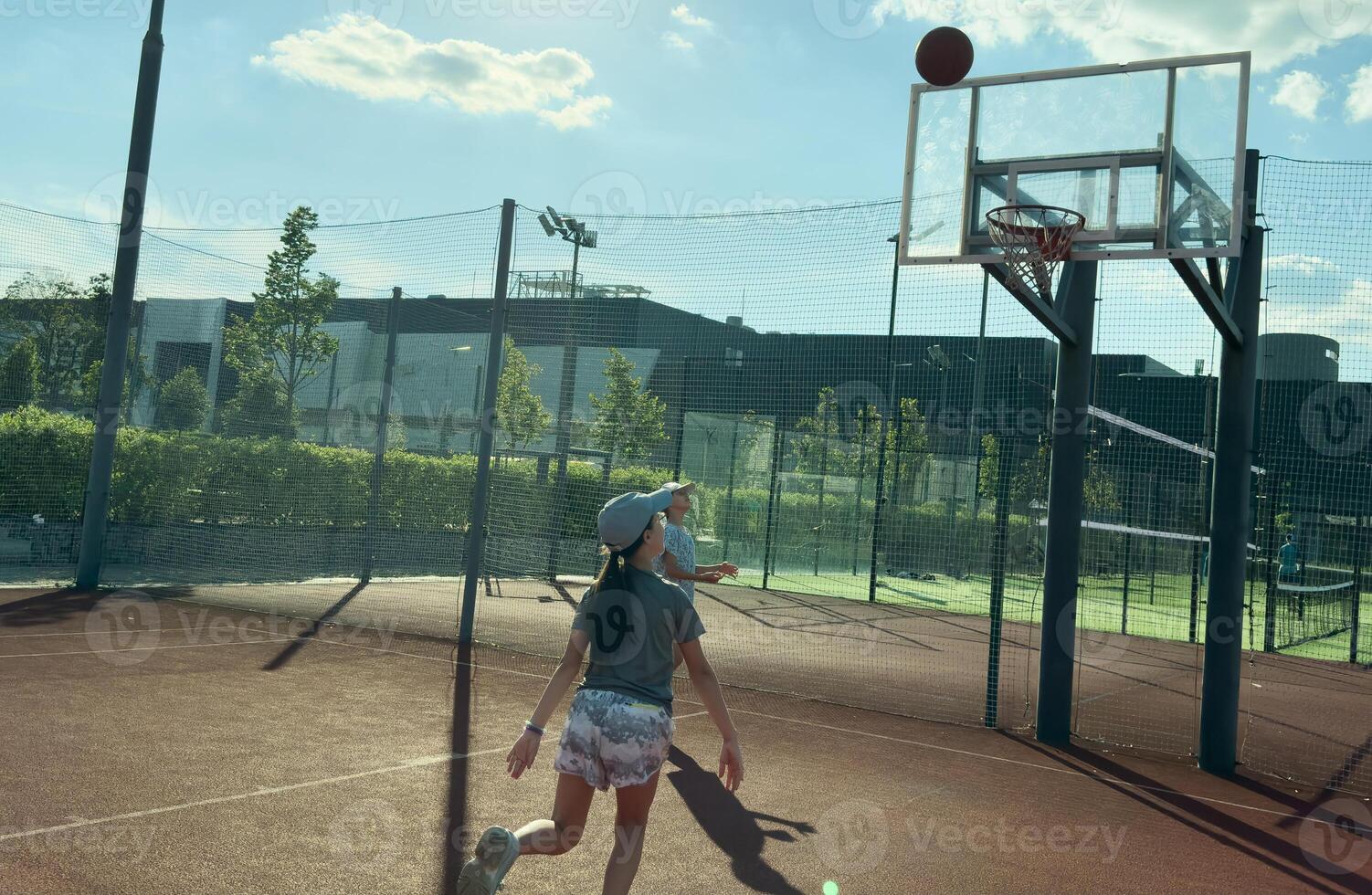 Girls play Street Basketball in the summer Street Basketball League photo