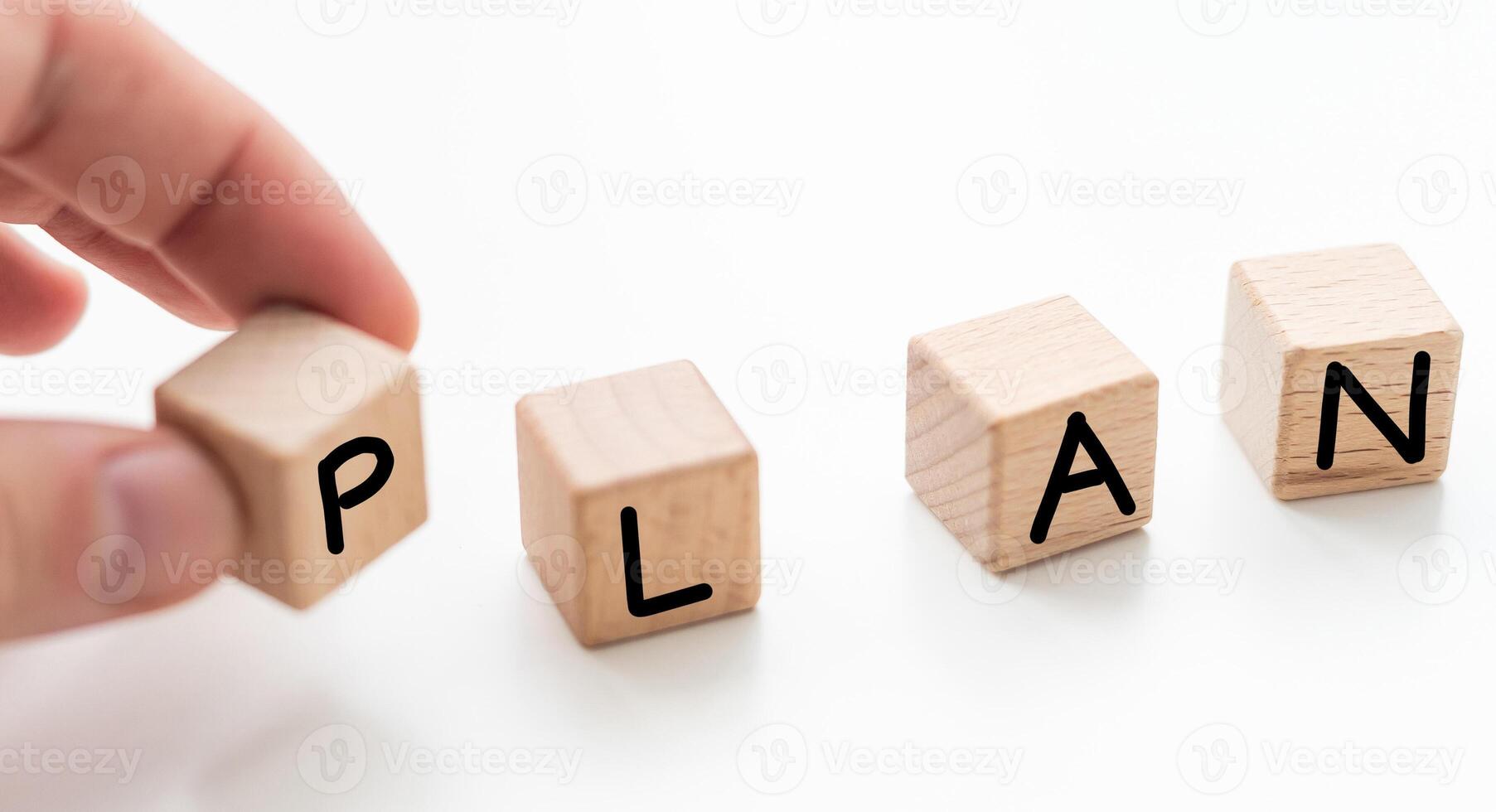 Hand putting wooden cube block for stacking plan wording concept. photo