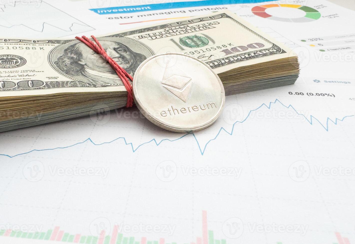 Gold ethereum cryptocurrency coin on stock market line graph trading chart. Top view. photo