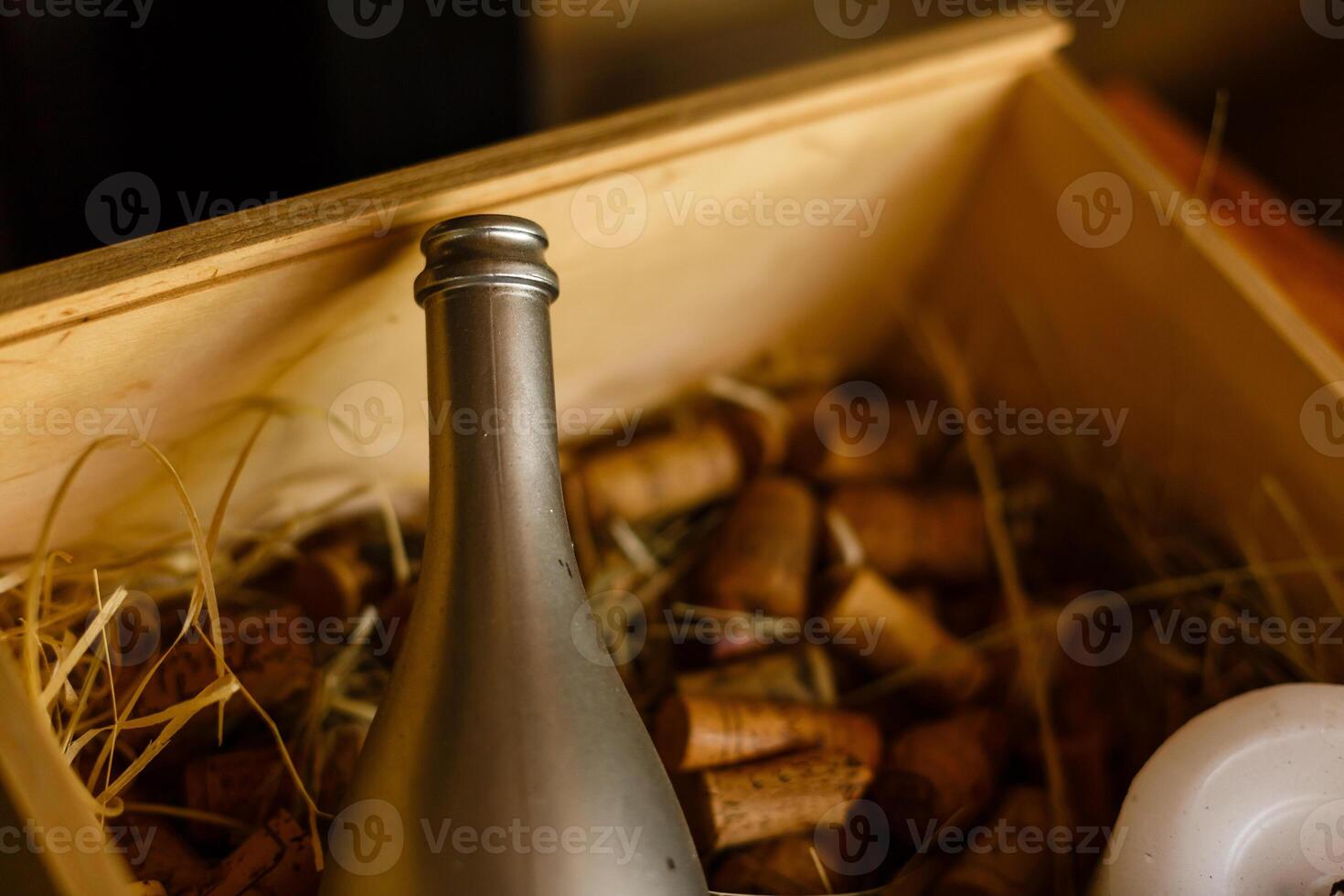 Wooden box with empty wine bottles, bottles blurred. photo