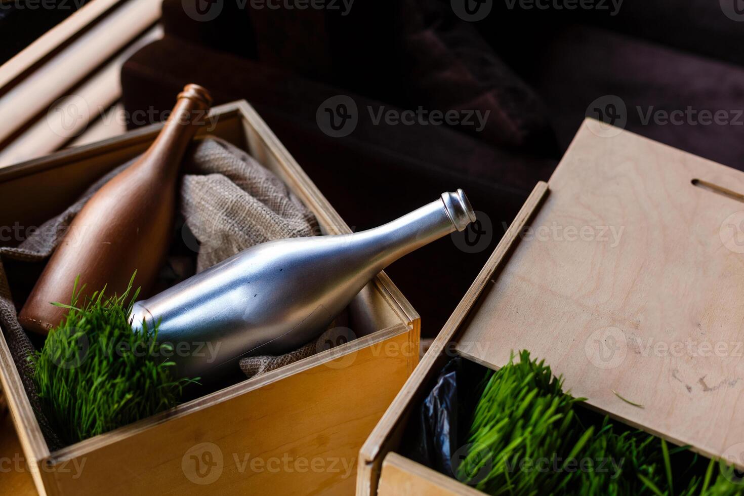 Wooden box with empty wine bottles, bottles blurred. photo