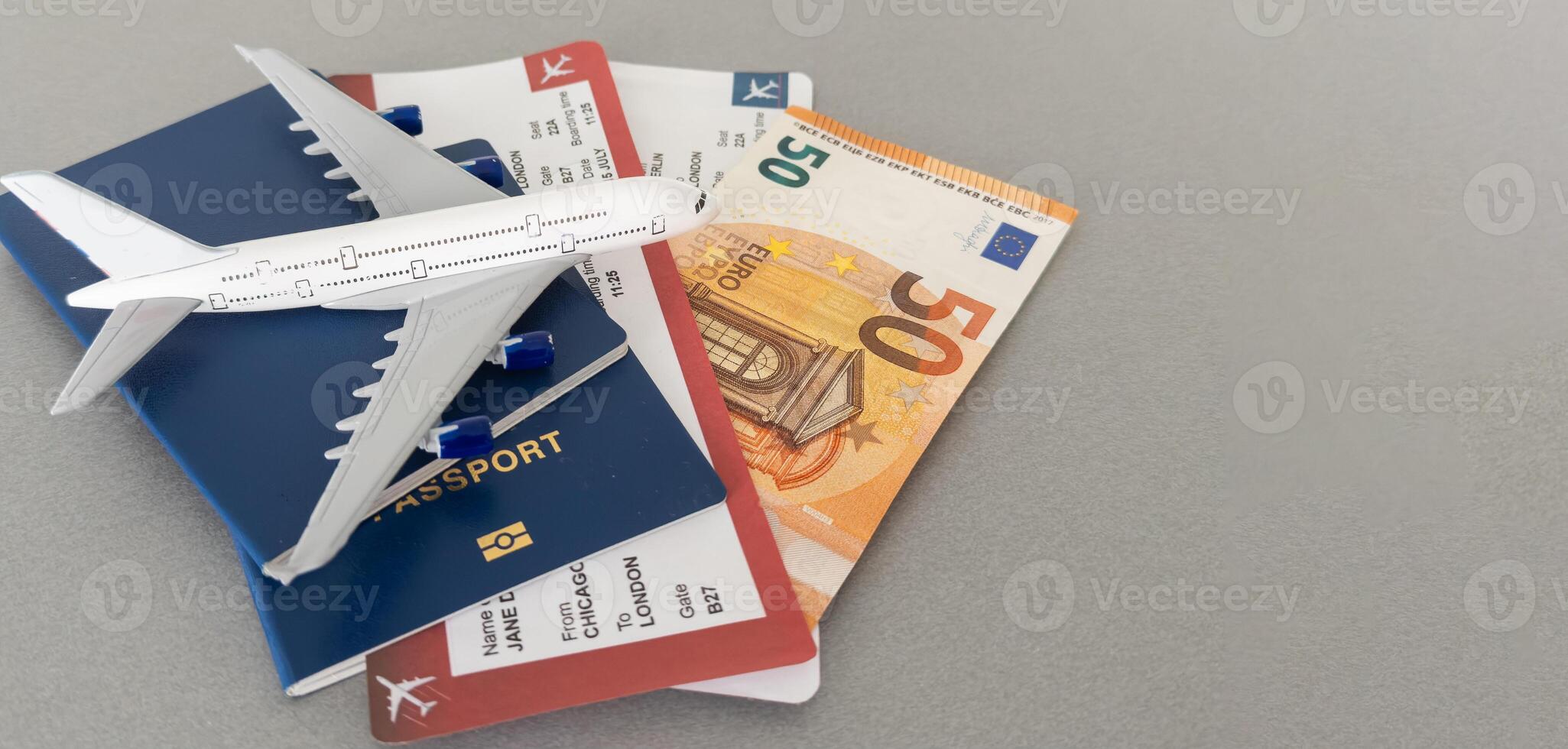 Top view of traveler accessories, passports and air tickets on background with copy space for text. Travel vacation concept photo