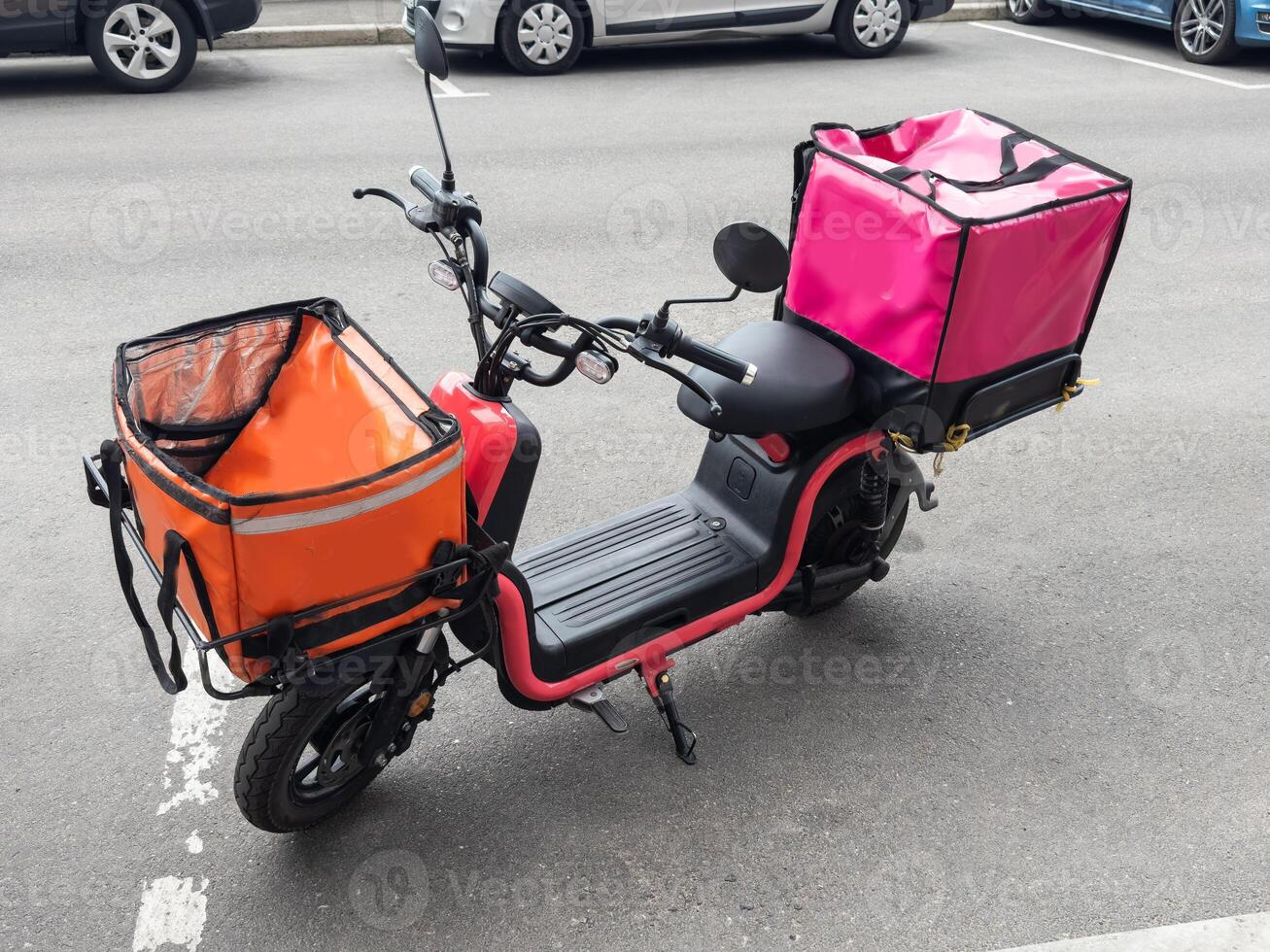 Scooter express delivery service. Red motor bike with delivery bag photo