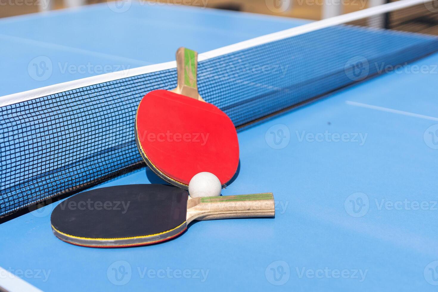 table tennis ball and paddle photo