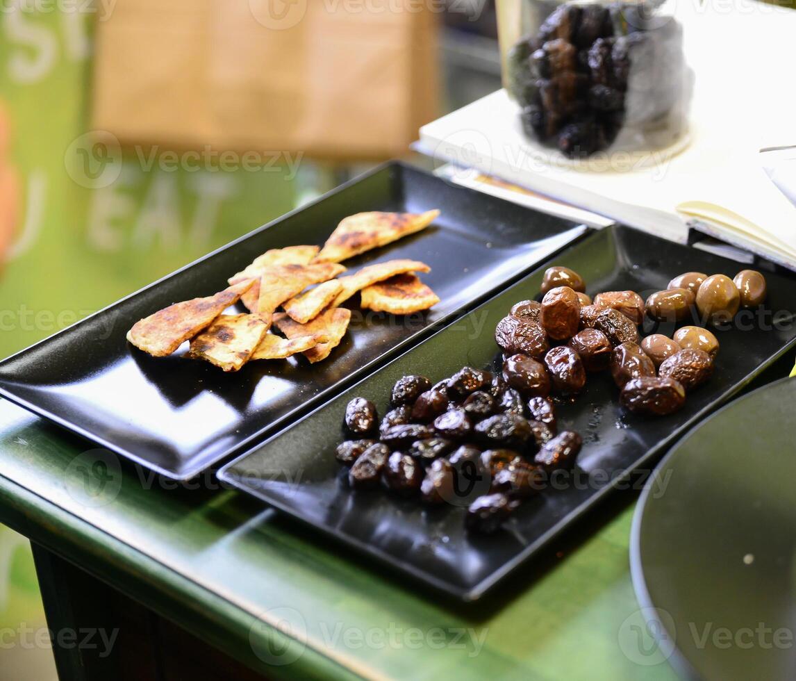 Cheese arranged on a dark table. Different sorts of cheese. Various types of cheese photo