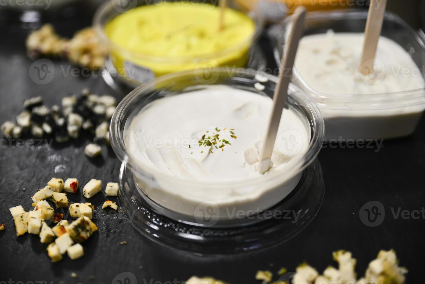 Cheese arranged on a dark table. Different sorts of cheese. Various types of cheese photo
